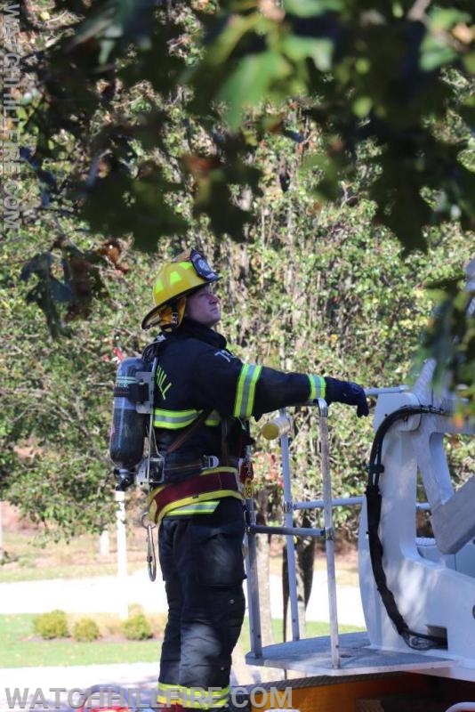 Firefighter Michael O'Connor while preparing for roof operations at recent building fire.