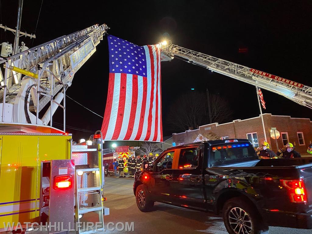 The flag was displayed during a drive by event to honor Philip Panciera for his more than 60 years of dedicated service to the Misquamicut Fire Department. 