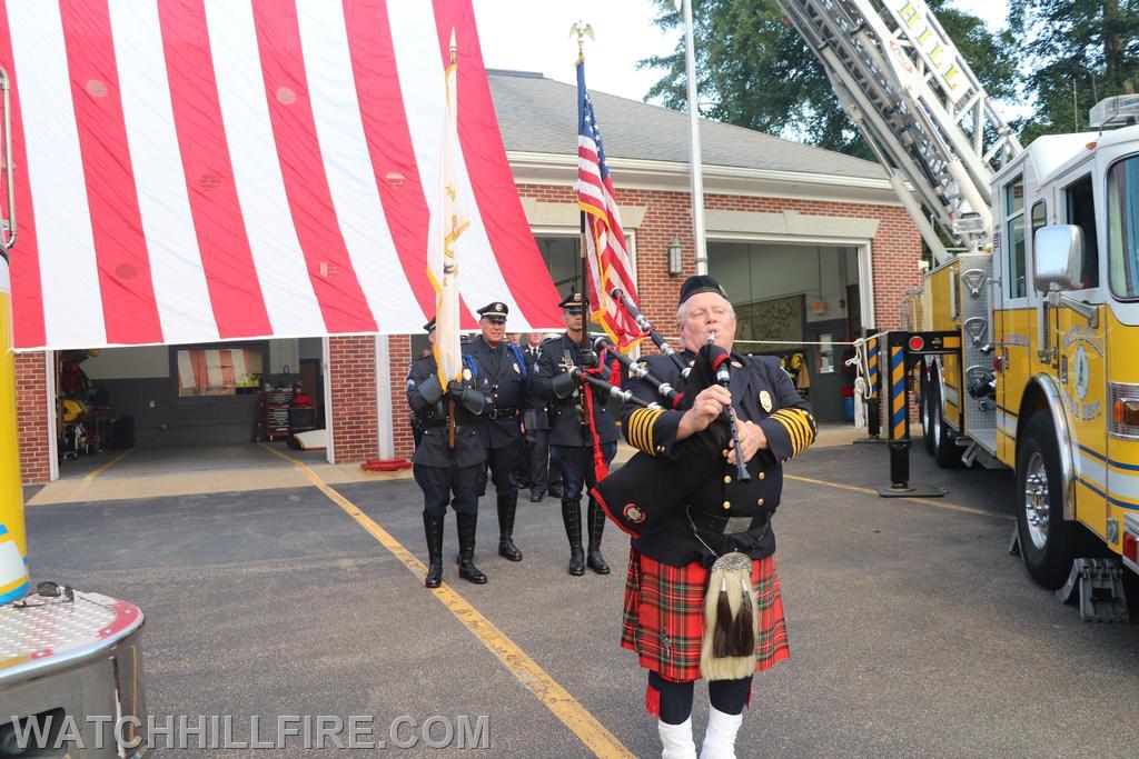 Chief Bob Bradley plays the bagpipes for the procession