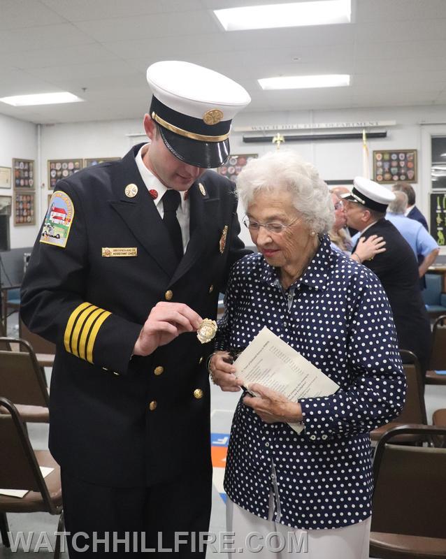 Asst. Chief Koretski is presented his Great Grandfather's badge from his time as the Ashaway Fire Chief by his Grandmother Betty