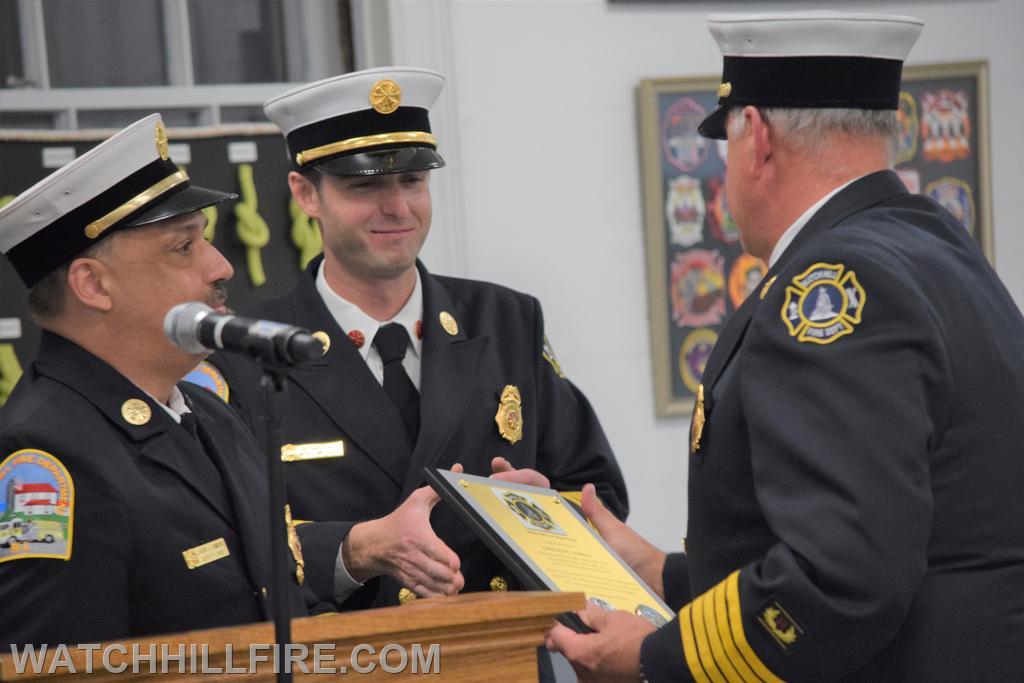 Chief Harold receives his award plaque