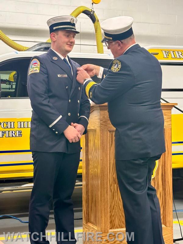 Past Chief Scott Harold pins his son Rees as a new Lieutenant 