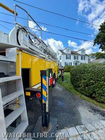 Ladder 104 was positioned in an ideal spot to access the roof of the house with its 100 foot aerial ladder. Crews ascended the ladder and checked the chimney and surrounding roof area for fire extension. 